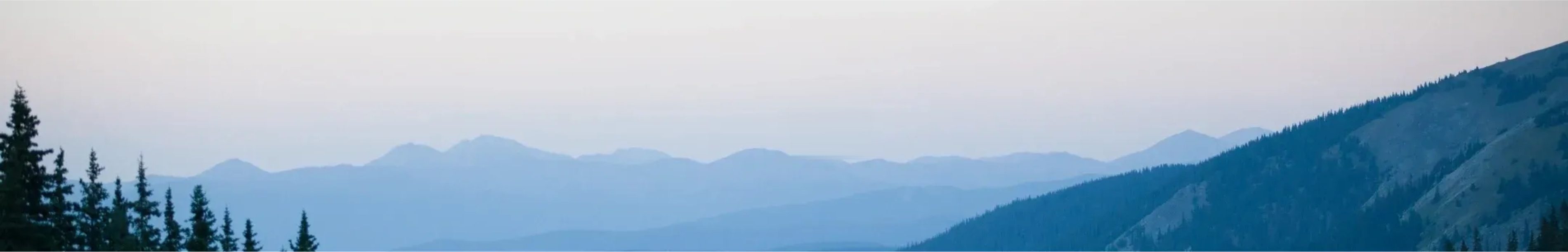 Layered blue mountain range fading into the distance